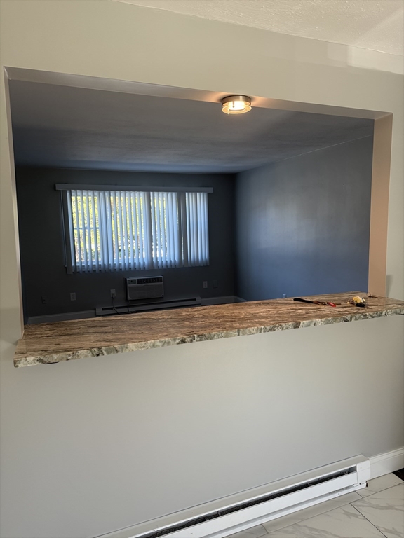 15 Washington Street, Unit 9 Plainville, MA 02762 - Photo 7 of 11 a view of a livingroom with a window