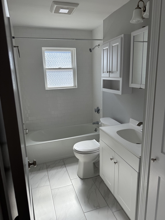 15 Washington Street, Unit 9 Plainville, MA 02762 - Photo 10 of 11 a bathroom with a toilet a sink and bathtub