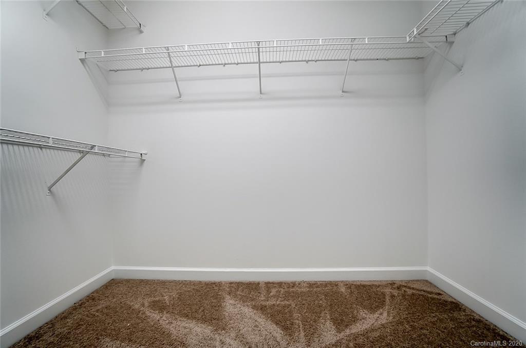 14010 Wild Elm Road Charlotte, NC 28277 - Photo 26 of 36 a view of a room with racks on the wall