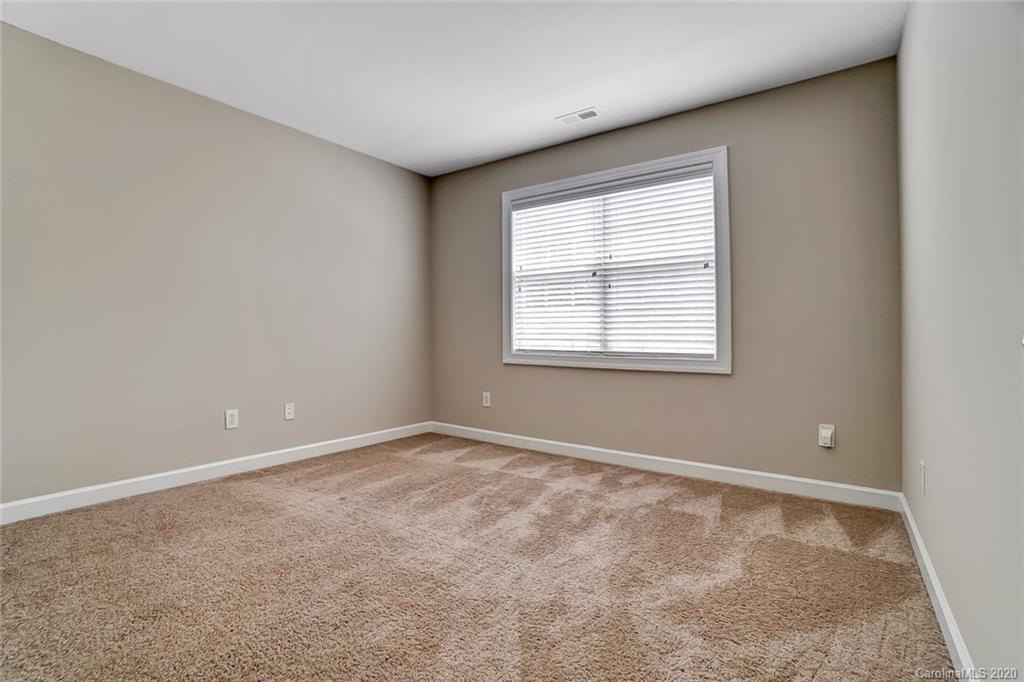 14010 Wild Elm Road Charlotte, NC 28277 - Photo 27 of 36 an empty room with a window