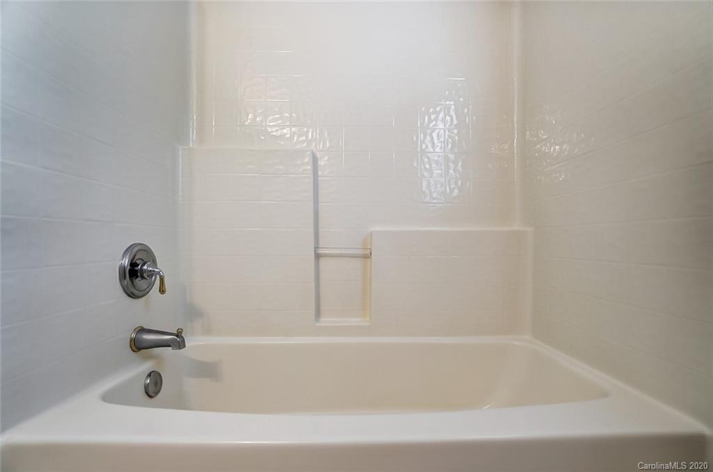 14010 Wild Elm Road Charlotte, NC 28277 - Photo 30 of 36 a bathroom with bathtub