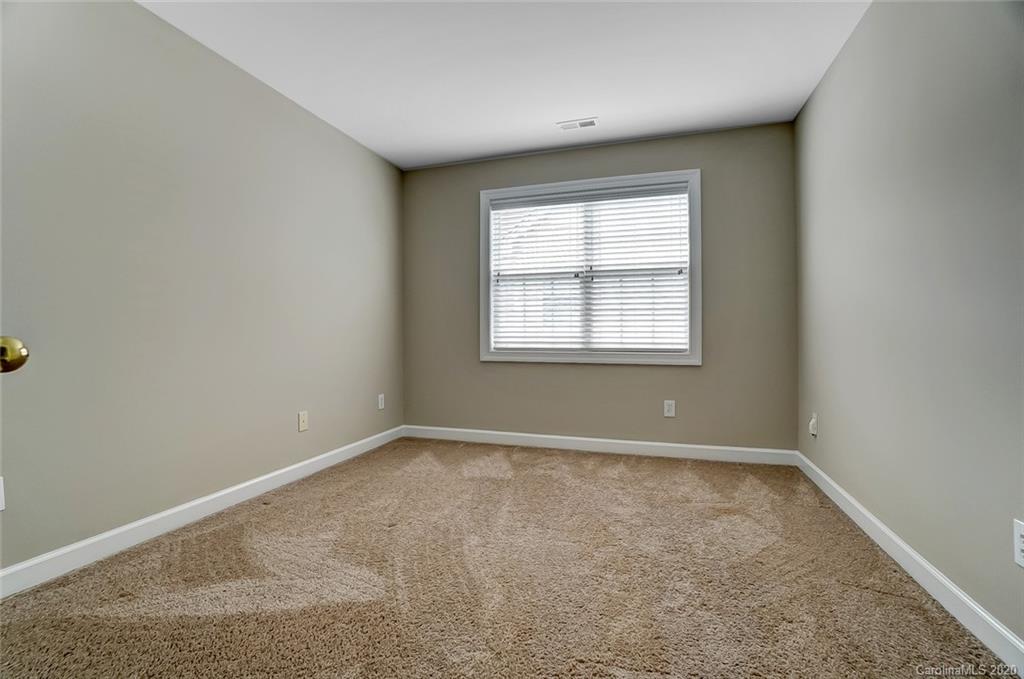 14010 Wild Elm Road Charlotte, NC 28277 - Photo 31 of 36 an empty room with a window