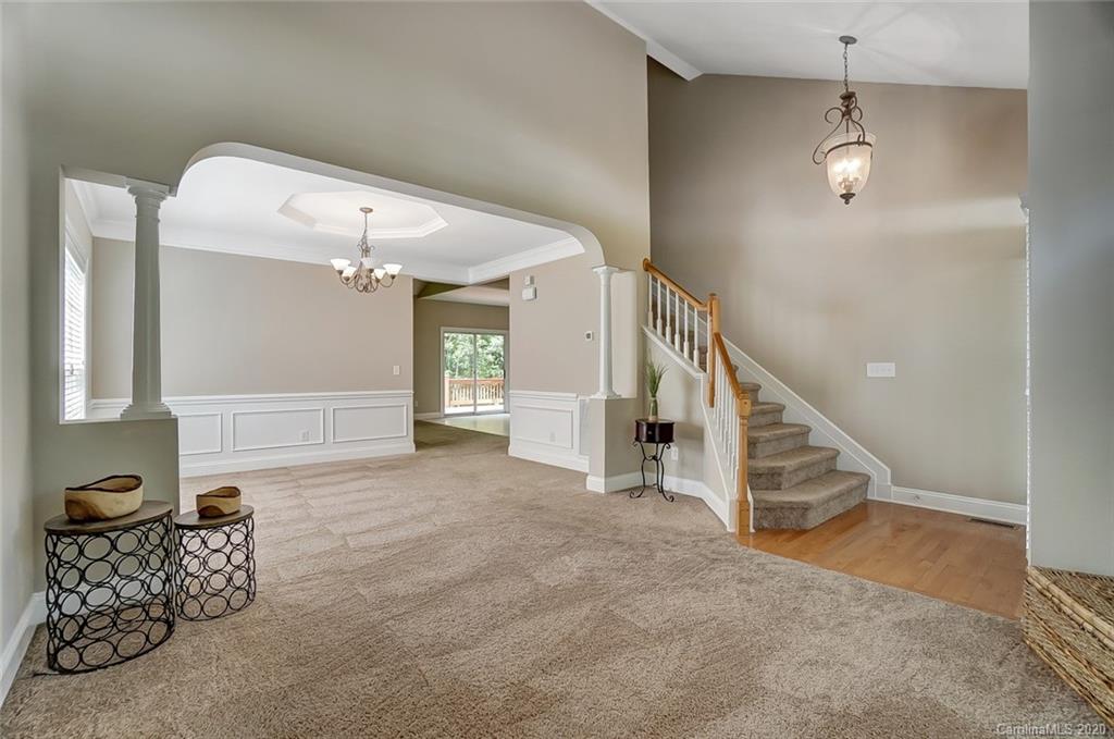 14010 Wild Elm Road Charlotte, NC 28277 - Photo 5 of 36 a view of a livingroom with furniture and staircase