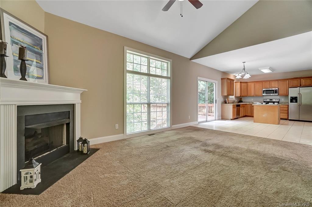 14010 Wild Elm Road Charlotte, NC 28277 - Photo 10 of 36 a view of a livingroom with a fireplace and window