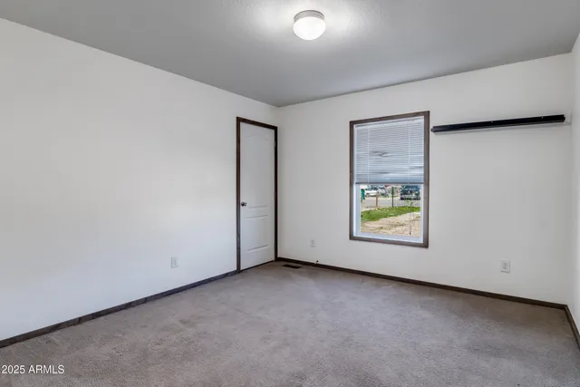 a kitchen with a stove and a refrigerator