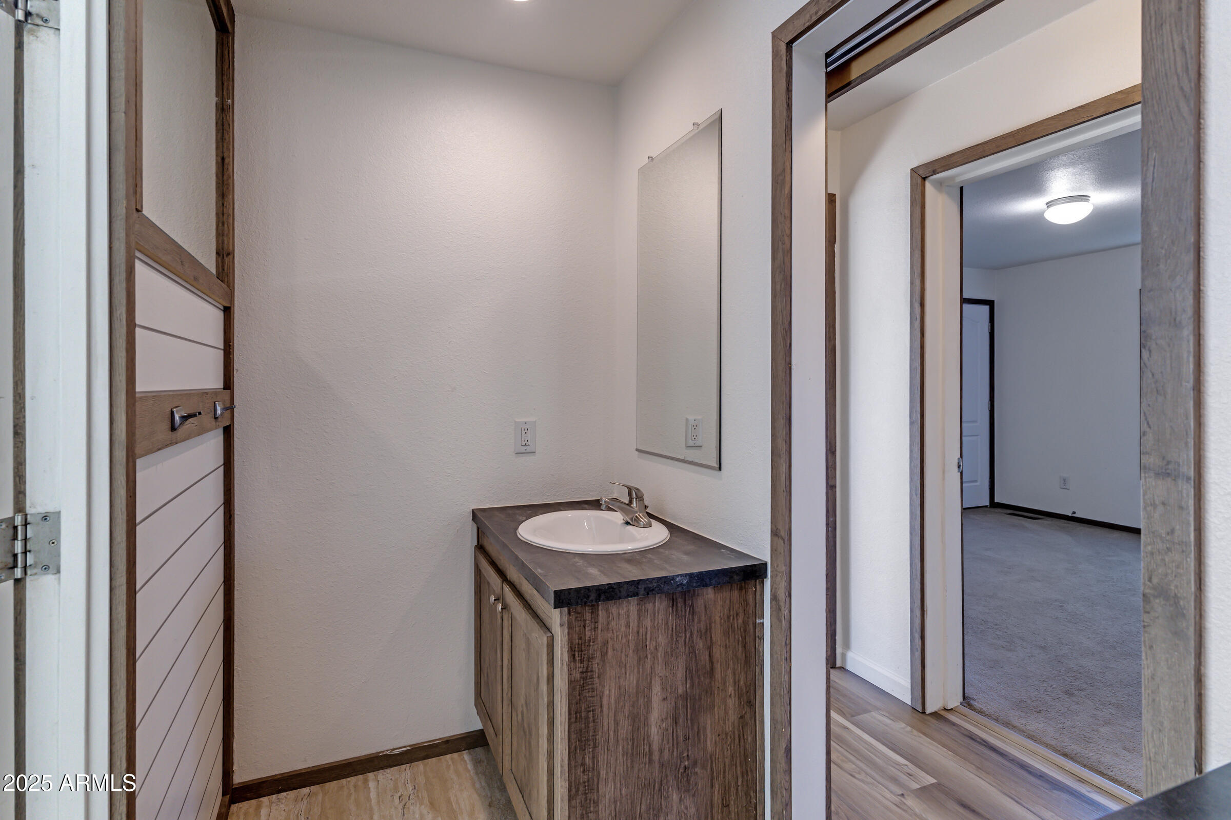 11341 East 6th Avenue Apache Junction, AZ 85120 - Photo 21 of 37 a view of a hallway with elevator