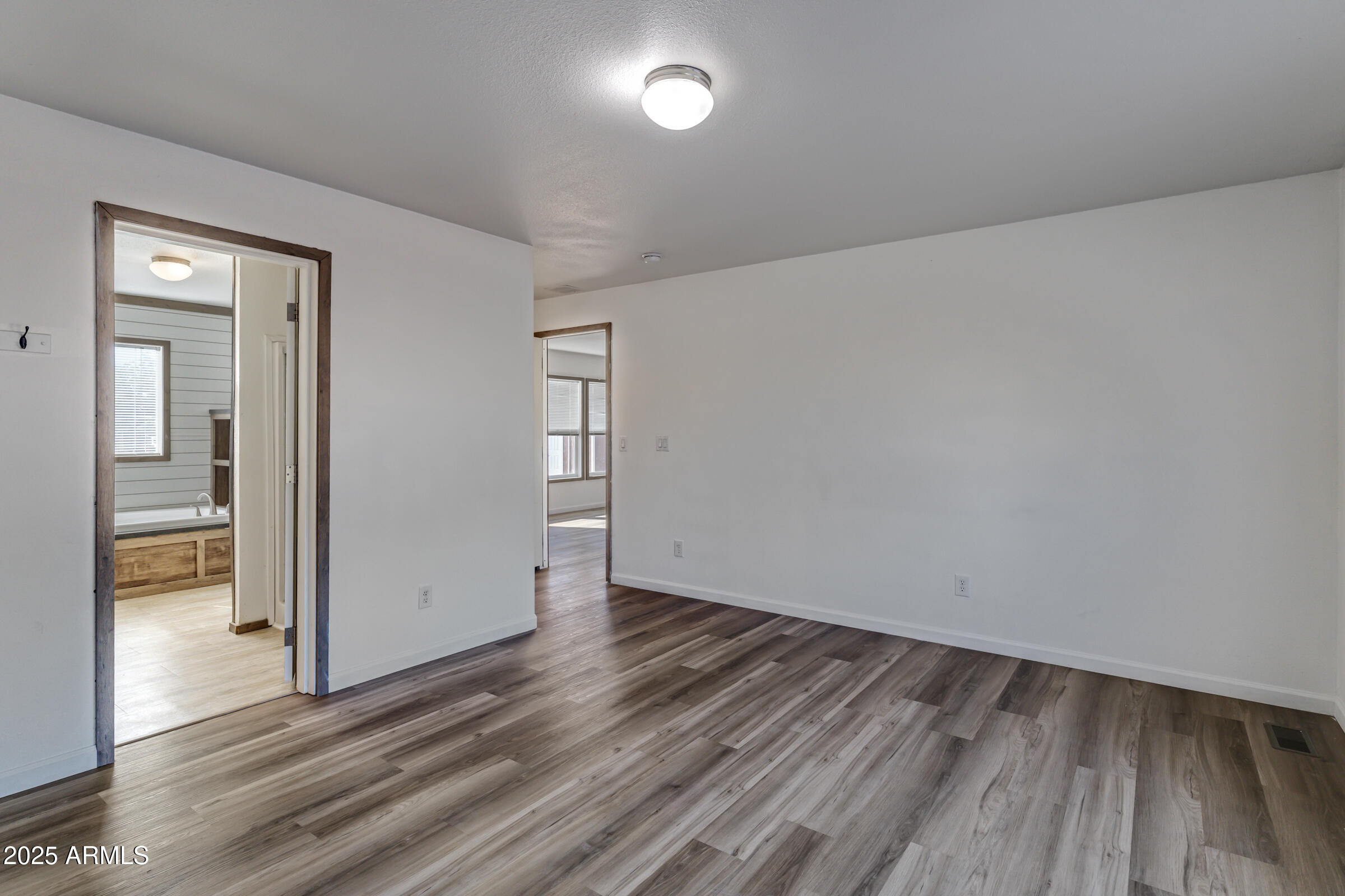 11341 East 6th Avenue Apache Junction, AZ 85120 - Photo 25 of 37 wooden floor in an empty room