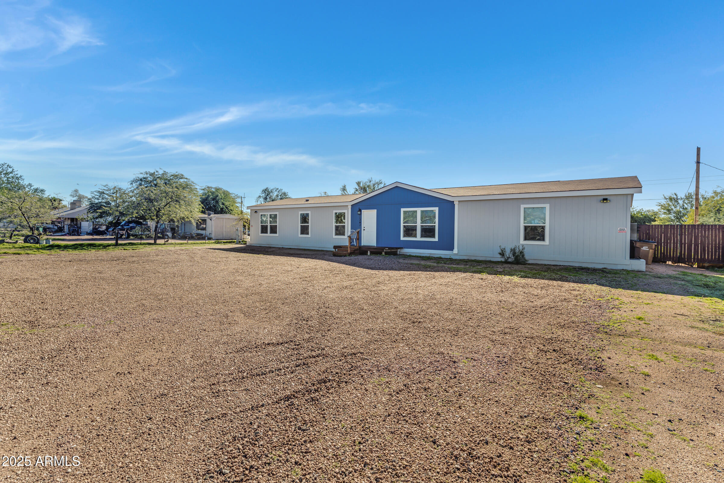 11341 East 6th Avenue Apache Junction, AZ 85120 - Photo 3 of 37 a view of a house with a yard and sitting area