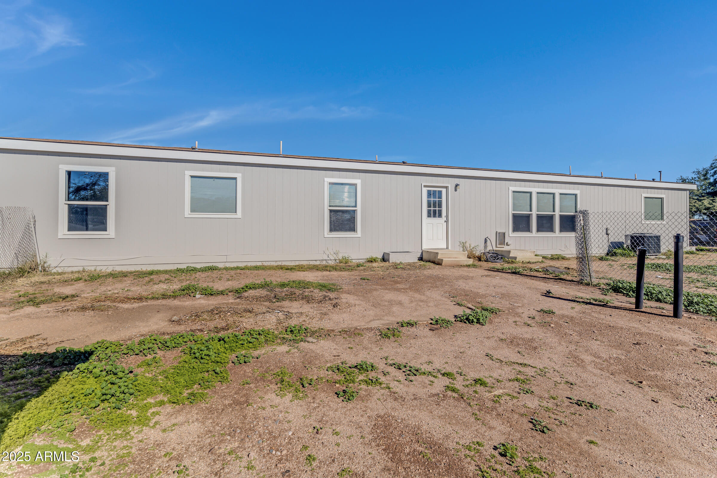 11341 East 6th Avenue Apache Junction, AZ 85120 - Photo 37 of 37 a view of a house with backyard and sitting area