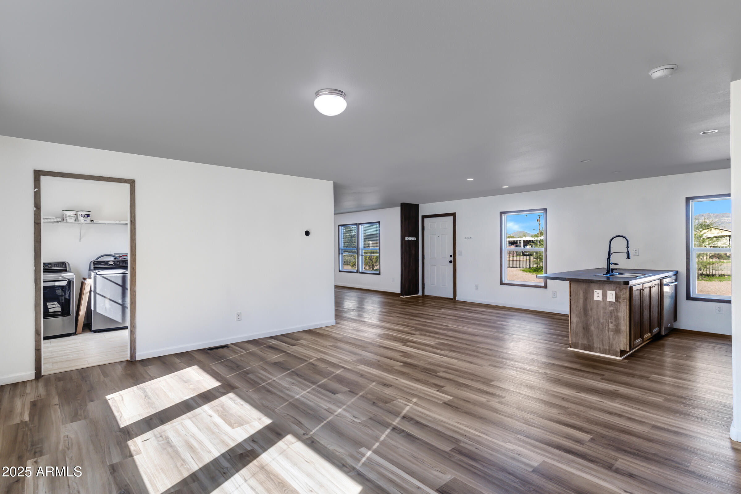 11341 East 6th Avenue Apache Junction, AZ 85120 - Photo 6 of 37 a view of a livingroom with wooden floor