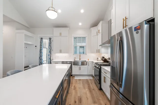 a view of walk in closet with empty racks