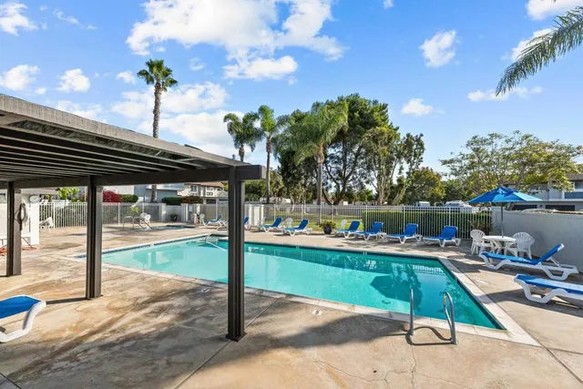 a view of a backyard with sitting area