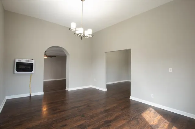 a view of livingroom with kitchen island wooden floor and window
