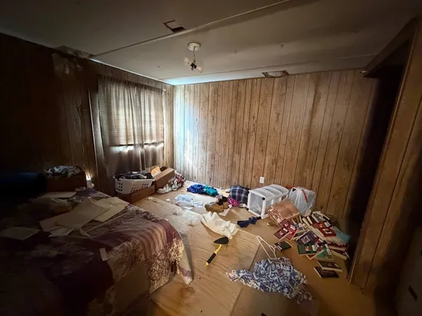 a kitchen with a refrigerator and a stove top oven