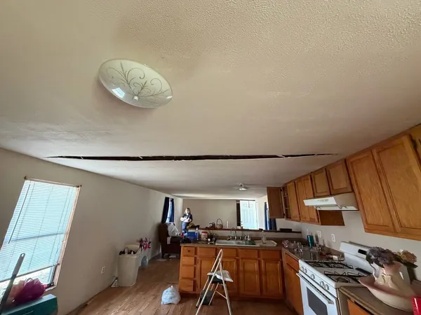 a view of a livingroom with furniture and a flat screen tv