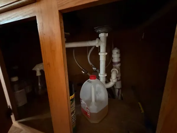 a room with wooden floor and furniture