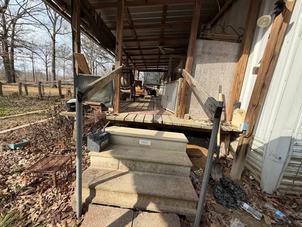 a bedroom with a bed and a wooden floor