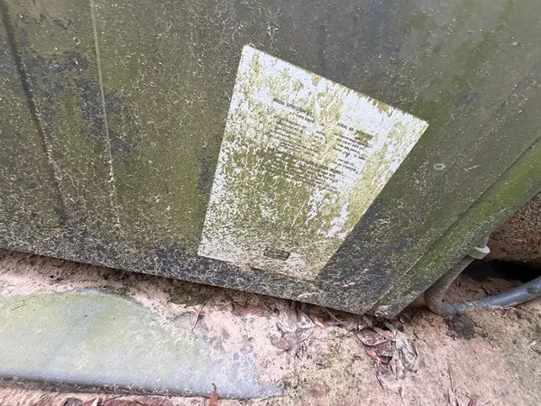 a view of house with a backyard