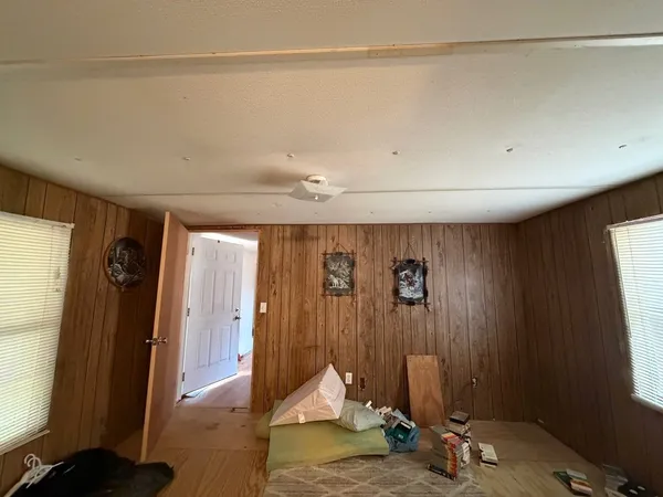 a living room with a furniture and a window