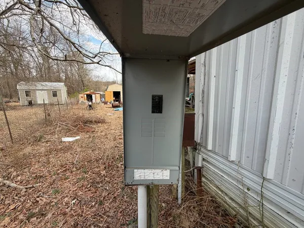 a view of a house with a yard covered in snow