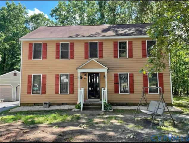 a house with trees in the background
