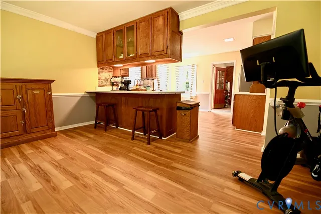 a room with wooden floors and furniture