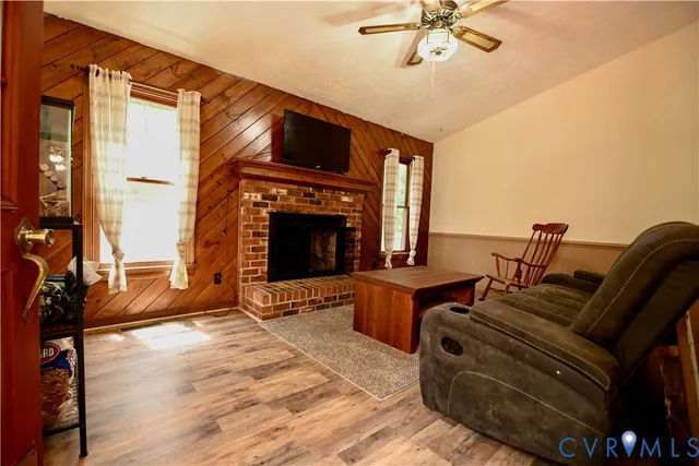 a living room with furniture and a fireplace