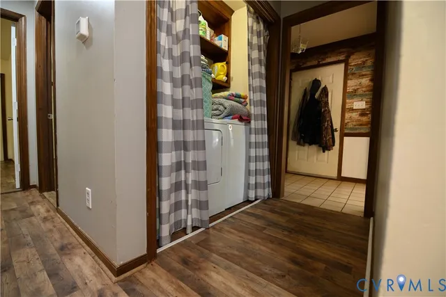 a view of a porch with wooden floor and a door