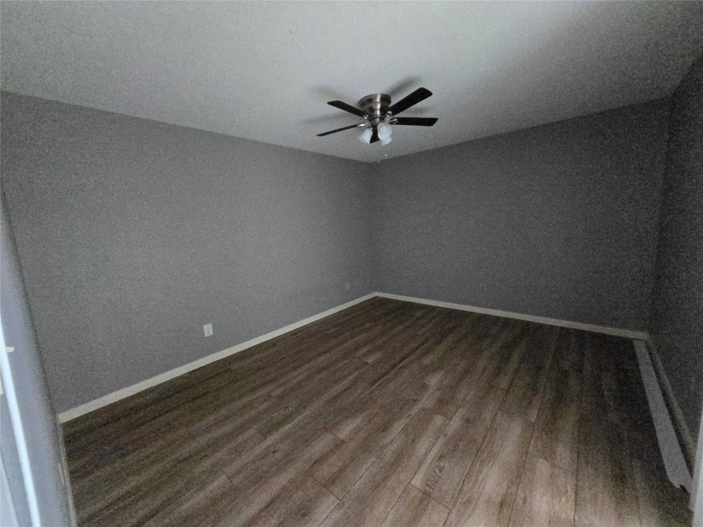 6401 Deihl Road, Unit 1006 Houston, TX 77092 - Photo 13 of 19 a view of a room with wooden floor and a ceiling fan