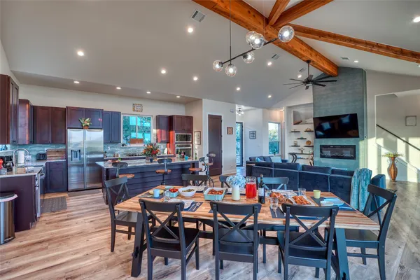 a living room with fireplace furniture and a flat screen tv
