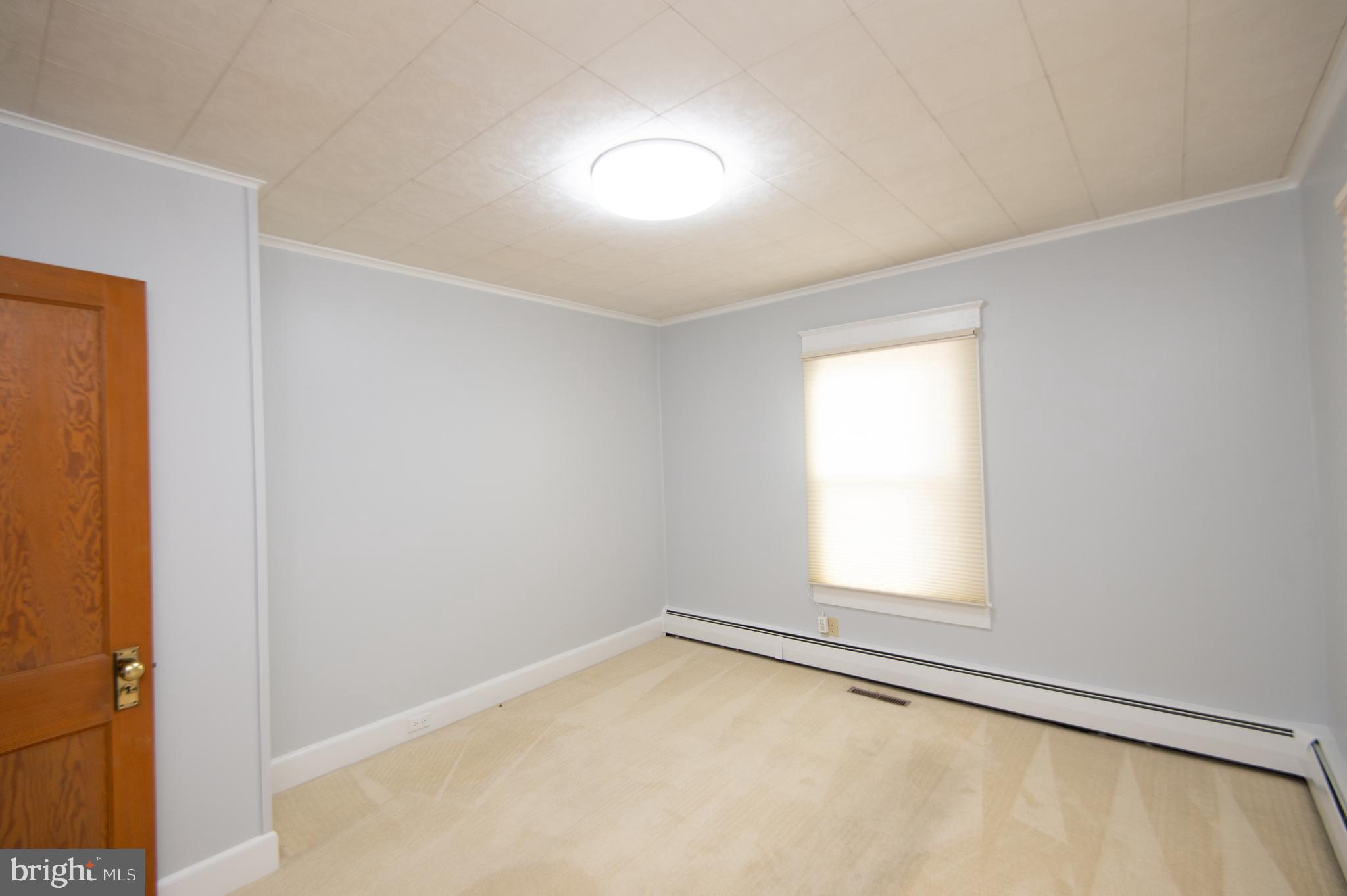 409 Bayly Avenue Cambridge, MD 21613 - Photo 14 of 54 an empty room with a window