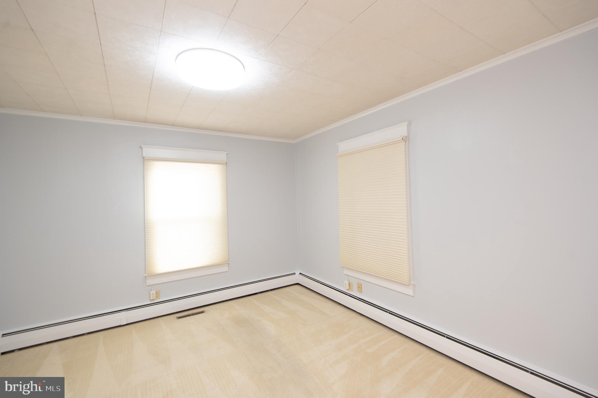 409 Bayly Avenue Cambridge, MD 21613 - Photo 17 of 54 an empty room with a window