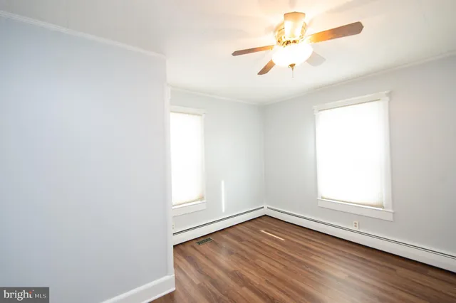 a view of a livingroom with wooden floor