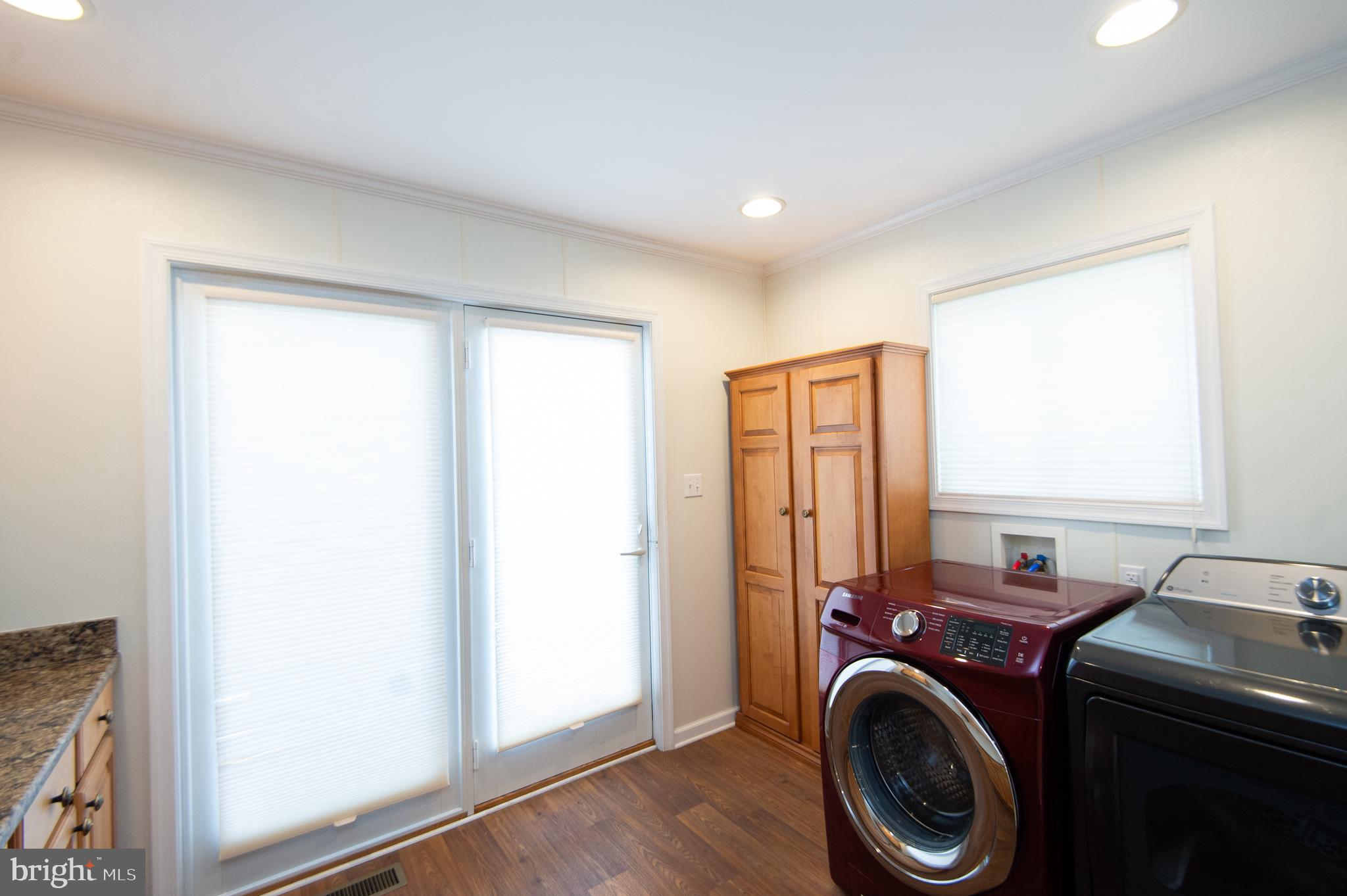 409 Bayly Avenue Cambridge, MD 21613 - Photo 27 of 54 a view of storage and utility room with washer and dryer