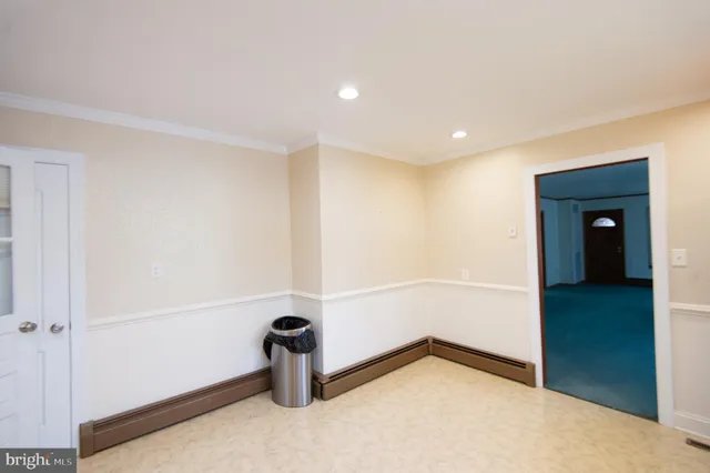 a hallway with granite countertop wooden floor