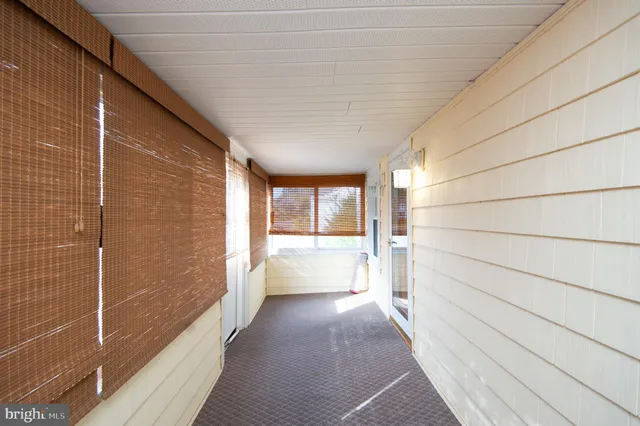 a view of an empty room with wooden roof