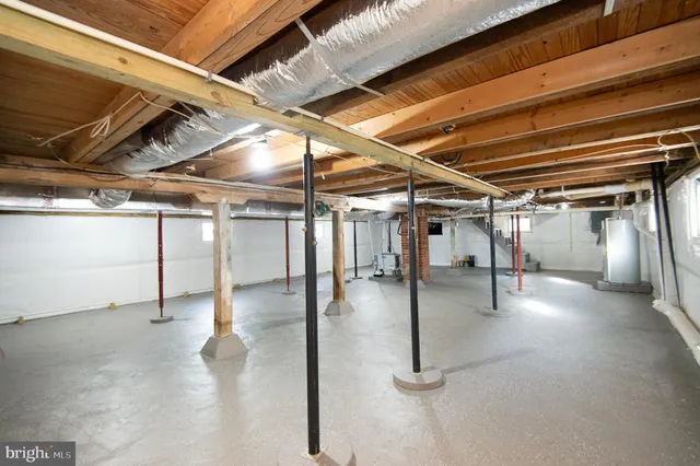 a view of a garage room with wooden walls