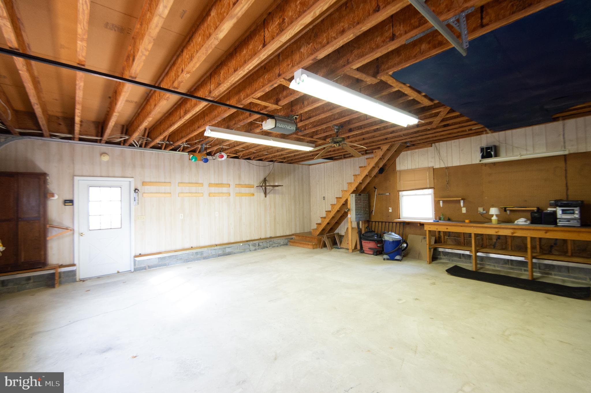 409 Bayly Avenue Cambridge, MD 21613 - Photo 43 of 54 a view of a garage room with wooden walls