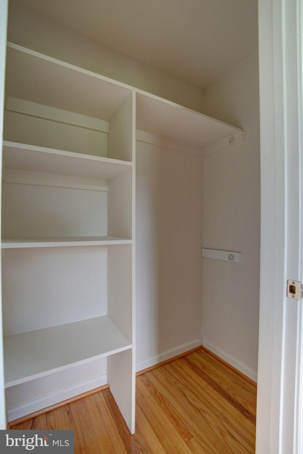 900 Walker Road Great Falls, VA 22066 - Photo 26 of 52 Spacious closet with sleek shelving.