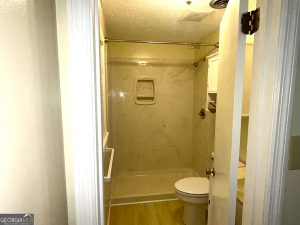 a bathroom with a sink and toilet