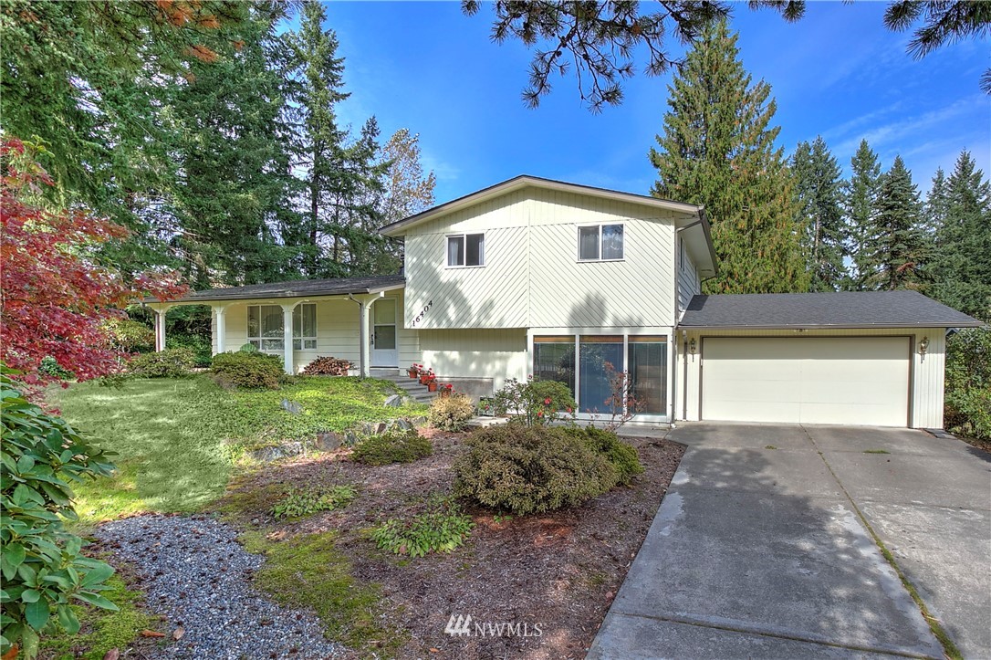 16404 Southeast 135th Street Renton, WA 98059 - Photo 1 of 22 a front view of a house with a yard and garage