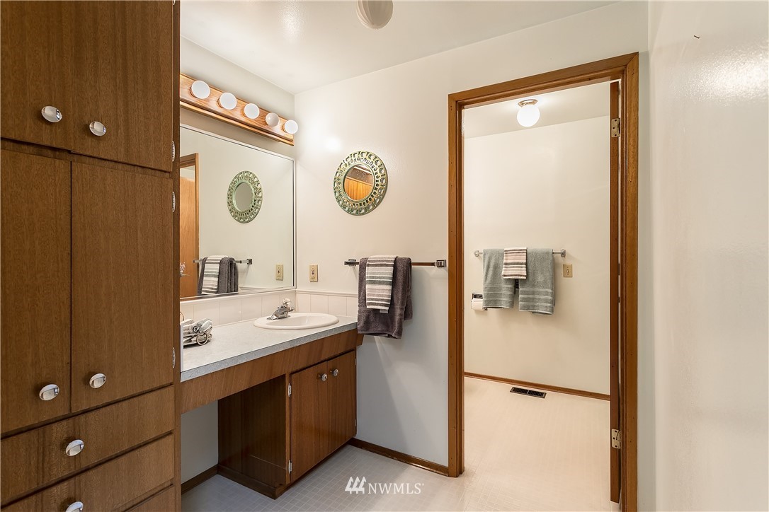 16404 Southeast 135th Street Renton, WA 98059 - Photo 11 of 22 a bathroom with a sink vanity and a mirror