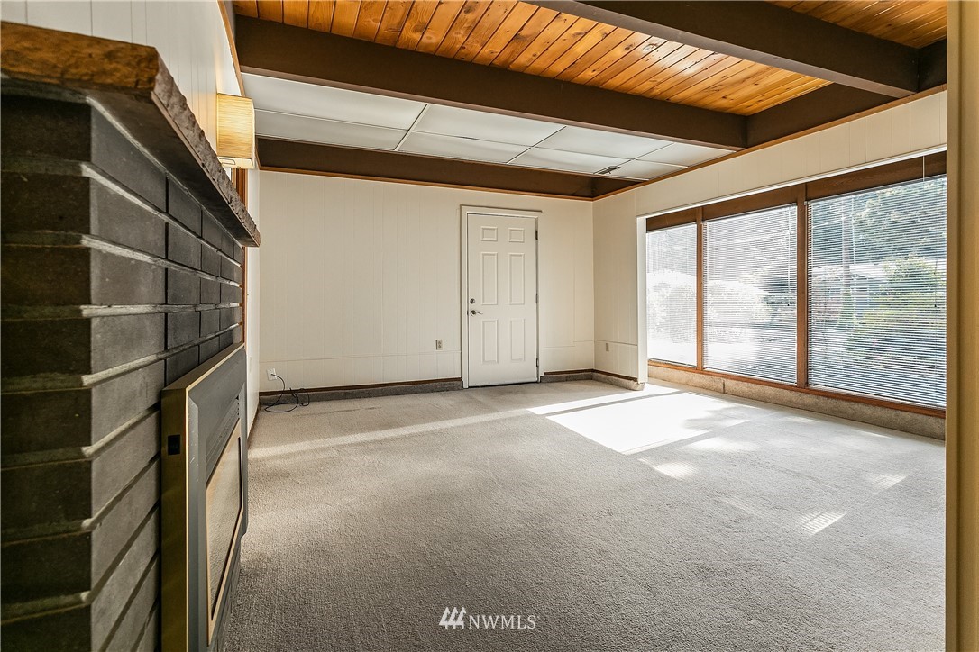 16404 Southeast 135th Street Renton, WA 98059 - Photo 17 of 22 a view of an empty room with a sliding door