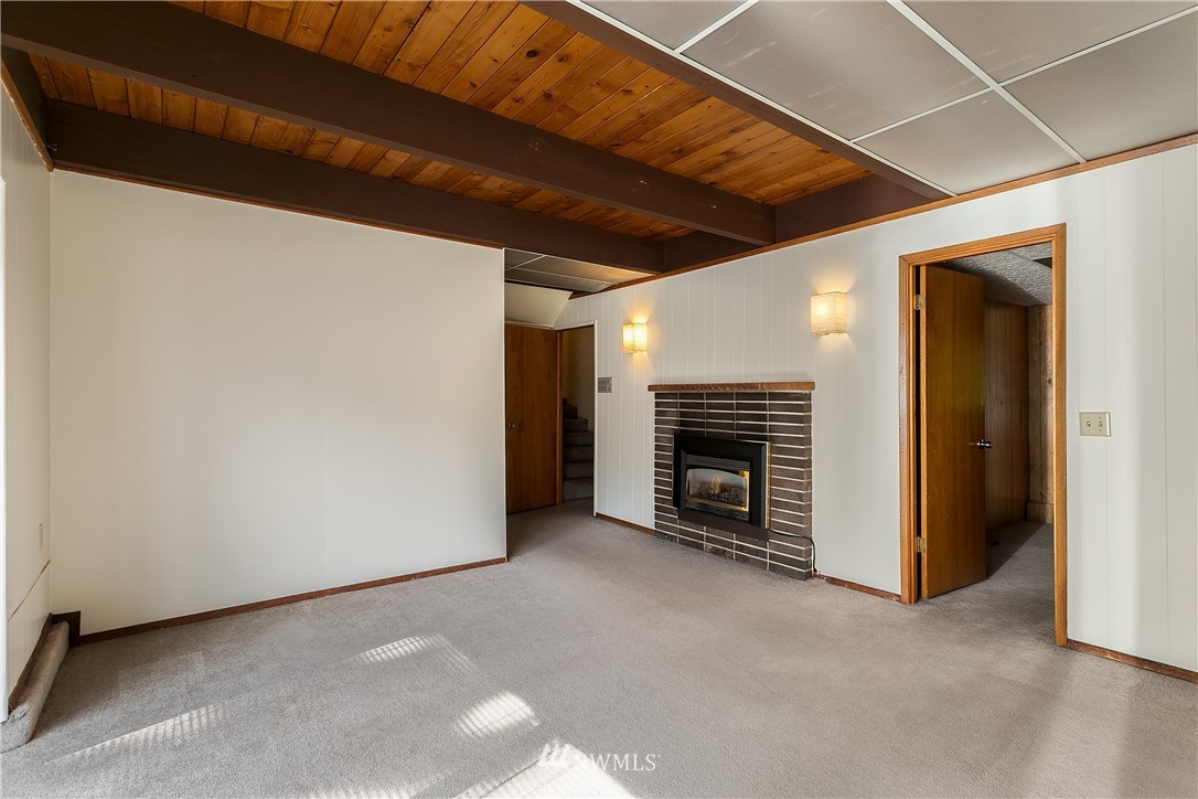 16404 Southeast 135th Street Renton, WA 98059 - Photo 18 of 22 a view of an empty room with a fireplace