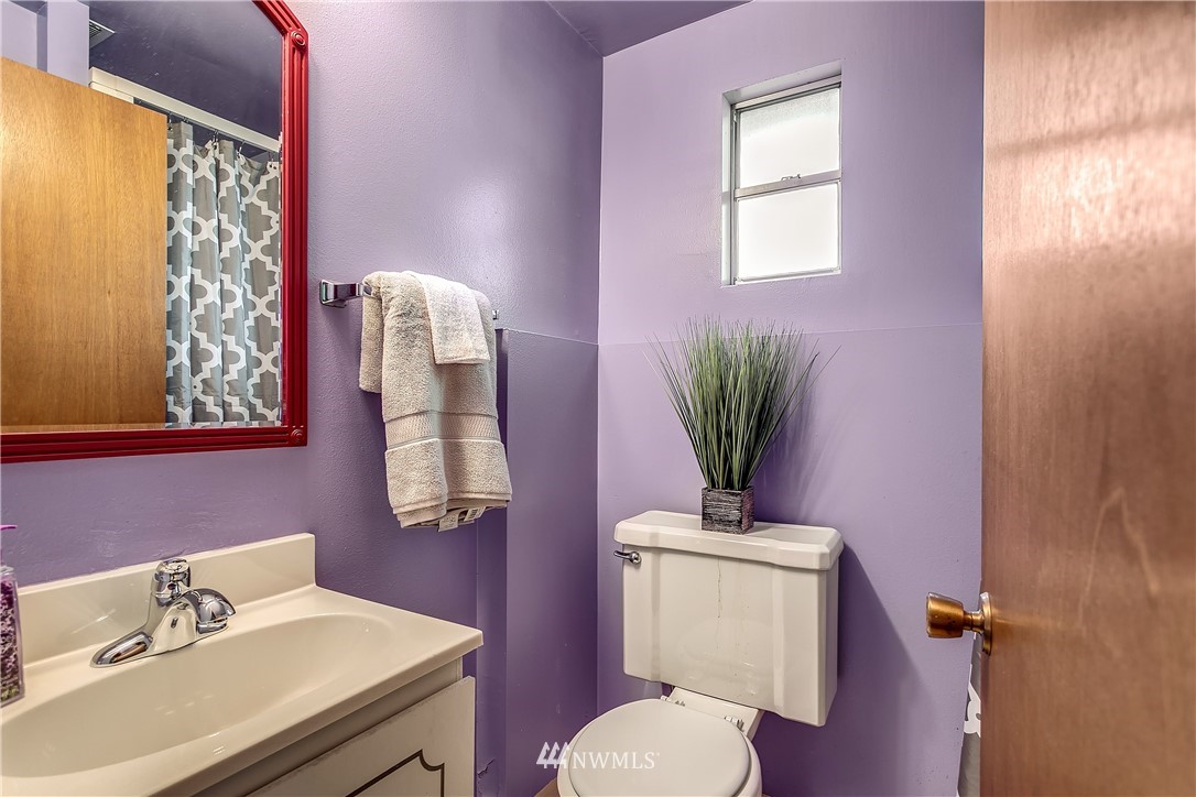 16404 Southeast 135th Street Renton, WA 98059 - Photo 21 of 22 a bathroom with a toilet a sink and a mirror