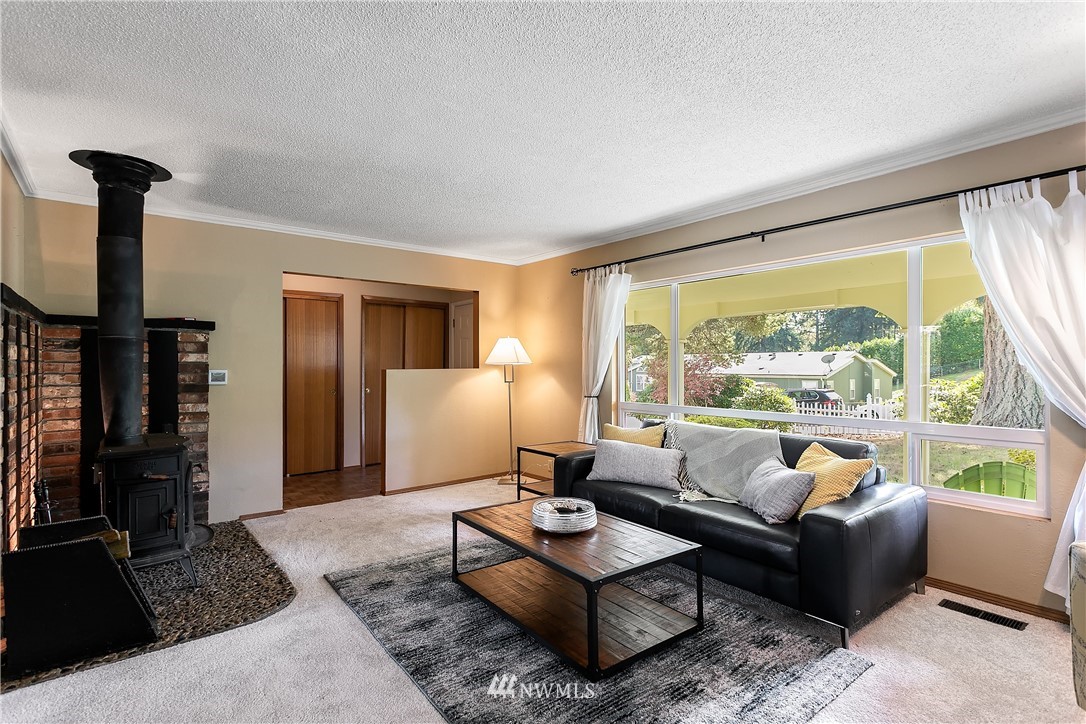 16404 Southeast 135th Street Renton, WA 98059 - Photo 6 of 22 a living room with furniture and a large window
