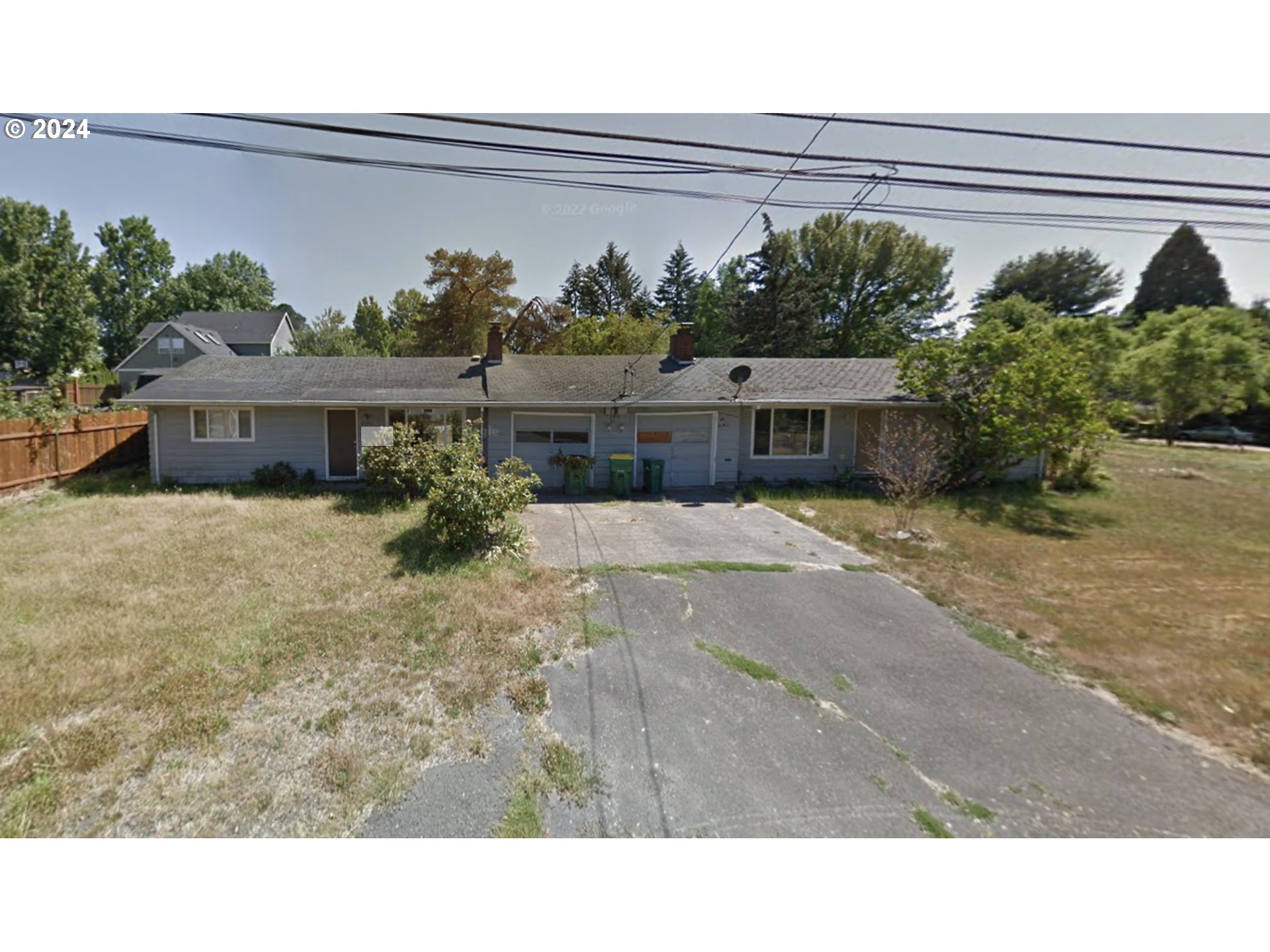8140 Southwest Oak Street Portland, OR 97223 - Photo 1 of 3 a black and white photo of a house