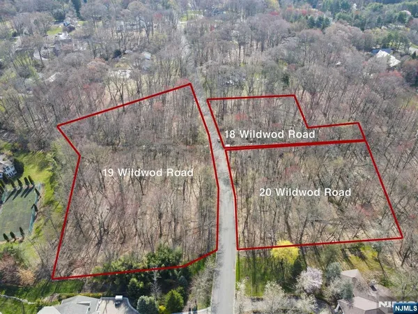 a aerial view of a house with a yard