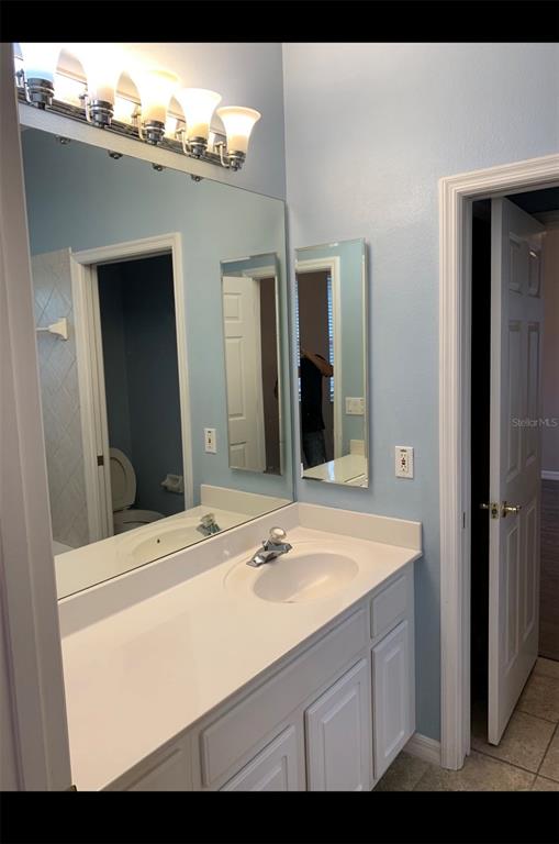 761 Broadoak Loop Sanford, FL 32771 - Photo 14 of 22 a bathroom with a sink and a mirror