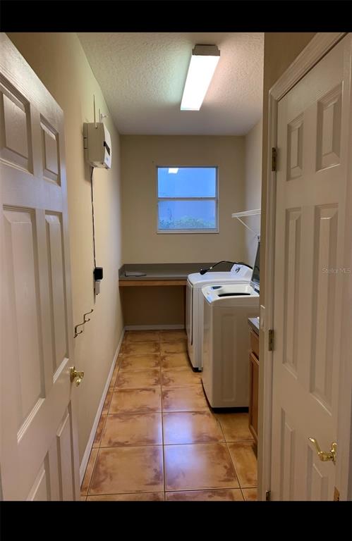 761 Broadoak Loop Sanford, FL 32771 - Photo 7 of 22 a view of storage and utility room with washer and dryer